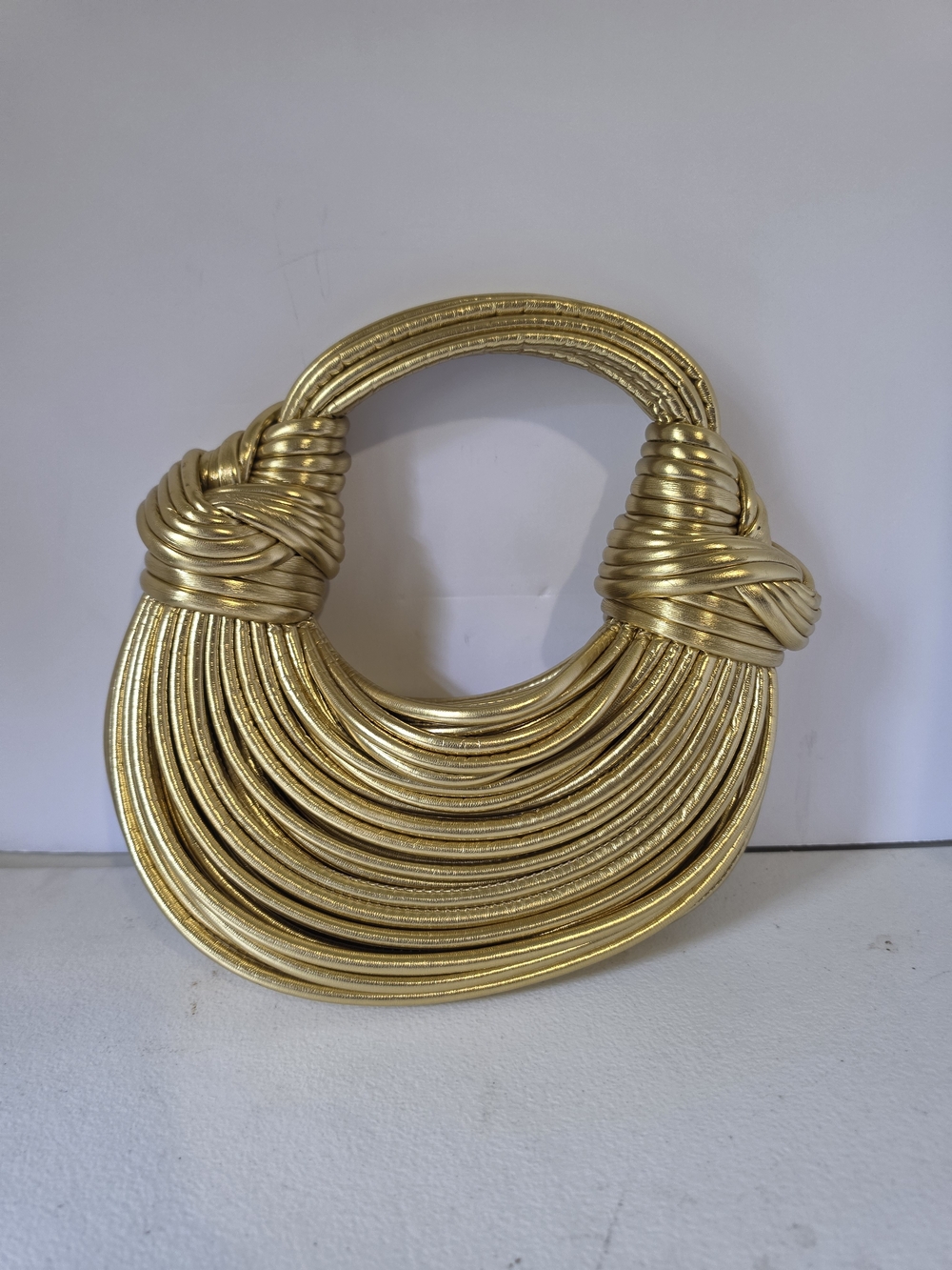 Elegant Gold Knot-Detail Wristlet Clutch